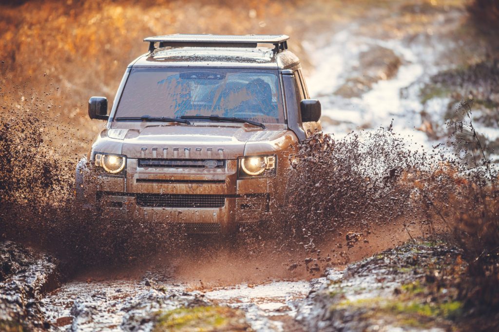 A picture of a defender driving in mud as used in the article about Sump Guard Price in Kenya